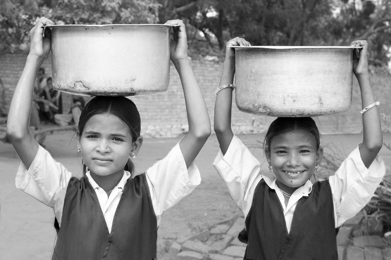 Human Right to Water in India - School girls carrying home water from a village handpump in Morena district, Madhya Pradesh